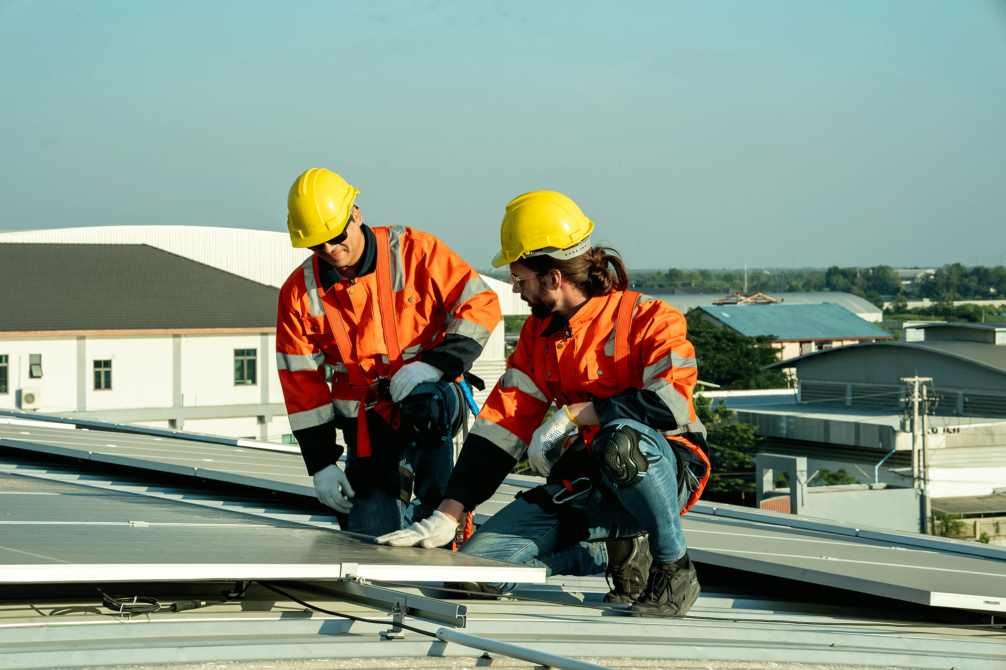 Engineer-Working-Setup-Solar-Panel-At-The-Roof-Top